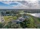 Drone shot showing the house in neighborhood near lake at 6972 Ripple Pond Loop, Zephyrhills, FL 33541