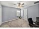 Bedroom featuring carpet, ceiling fan, and a window bringing in natural light at 6972 Ripple Pond Loop, Zephyrhills, FL 33541