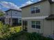 Exterior view of the back of the home and patio at 6972 Ripple Pond Loop, Zephyrhills, FL 33541