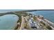 Aerial view showing waterfront property, buildings, and a road at 7 Elgin Pl # 502, Dunedin, FL 34698