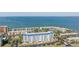 Aerial view of waterfront condo building with pool and parking at 7 Elgin Pl # 502, Dunedin, FL 34698