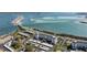 Aerial view of a coastal condo complex with parking and waterfront access at 7 Elgin Pl # 502, Dunedin, FL 34698