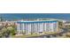 Waterfront condo building with parking and landscaping at 7 Elgin Pl # 502, Dunedin, FL 34698