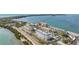 Aerial view of waterfront community with multiple buildings and parking at 7 Elgin Pl # 502, Dunedin, FL 34698