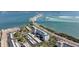 Aerial view of condo complex near the water with road and bridge at 7 Elgin Pl # 502, Dunedin, FL 34698