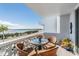 Private balcony with outdoor seating and stunning water views at 7 Elgin Pl # 502, Dunedin, FL 34698