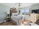 Bright bedroom with water views and built-in dresser at 7 Elgin Pl # 502, Dunedin, FL 34698