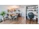 Bright dining area with a workspace and built-in shelving at 7 Elgin Pl # 502, Dunedin, FL 34698