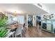 Open concept dining area with a view into the kitchen and living room at 7 Elgin Pl # 502, Dunedin, FL 34698