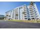 Exterior view of the Elgin building, a multi-story residential complex at 7 Elgin Pl # 502, Dunedin, FL 34698