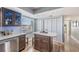 Eat-in kitchen with granite island and waterfront views at 7 Elgin Pl # 502, Dunedin, FL 34698