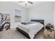 Bright bedroom with a queen bed and large window at 701 Garden Oaks Sq, Seffner, FL 33584