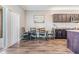 Kitchen dining area with wood table and four black chairs at 701 Garden Oaks Sq, Seffner, FL 33584