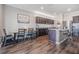 Open concept kitchen with island seating and dark wood cabinetry at 701 Garden Oaks Sq, Seffner, FL 33584