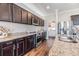 Kitchen with granite counters, stainless steel appliances and pantry at 701 Garden Oaks Sq, Seffner, FL 33584