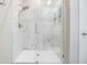 Large walk-in shower with marble-style tile and glass enclosure at 701 Garden Oaks Sq, Seffner, FL 33584