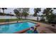 Backyard with pool and patio area at 7063 S Shore S Dr, St Petersburg, FL 33707