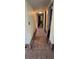 Hallway with tiled floor and water damage to walls at 7063 S Shore S Dr, St Petersburg, FL 33707