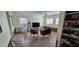 Living room with tiled floor, two chairs, and a TV at 7063 S Shore S Dr, St Petersburg, FL 33707