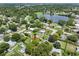 Aerial view showing home's location in a residential neighborhood near a lake at 7234 12Th N St, St Petersburg, FL 33702