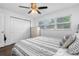 Bright bedroom with double bed, closet, and window at 7234 12Th N St, St Petersburg, FL 33702