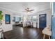 Bright living room with hardwood floors and blue walls at 7234 12Th N St, St Petersburg, FL 33702