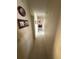 Long hallway with light walls and tiled floors at 804 E 128Th Ave, Tampa, FL 33612