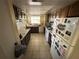 Galley kitchen with white appliances and wood cabinets at 804 E 128Th Ave, Tampa, FL 33612