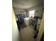 Laundry room with washer, dryer, and storage shelves at 804 E 128Th Ave, Tampa, FL 33612