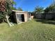 Wooden shed with ladder in the backyard at 804 E 128Th Ave, Tampa, FL 33612