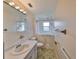 Bathroom features walk-in shower and updated vanity at 816 Knight St, Seffner, FL 33584