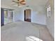 Living room with pool view, carpet flooring, and ceiling fan at 816 Knight St, Seffner, FL 33584