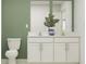 Double vanity bathroom with white cabinets and a calming color scheme at 8418 Bella Mar Trl, Parrish, FL 34219