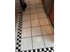 Beige and black checkered tile kitchen floor at 8814 Mill Creek Ln, Hudson, FL 34667