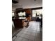 Kitchen island with granite countertop and wood cabinets at 8814 Mill Creek Ln, Hudson, FL 34667