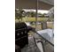 Patio with grill and table overlooking a pond at 8814 Mill Creek Ln, Hudson, FL 34667