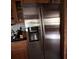 Stainless steel refrigerator with an ice and water dispenser at 8814 Mill Creek Ln, Hudson, FL 34667