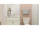 Small bathroom with white vanity, shower, and toilet at 9389 Runaway Breeze Dr, Land O Lakes, FL 34637