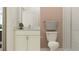 Small bathroom with white vanity, shower, and toilet at 9389 Runaway Breeze Dr, Land O Lakes, FL 34637