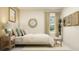 Serene bedroom with a neutral color palette and ample natural light at 9443 Runaway Breeze Dr, Land O Lakes, FL 34637