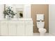 Bathroom with white vanity, toilet, and shower at 9728 Runaway Breeze Dr, Land O Lakes, FL 34637