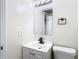 Simple bathroom with white vanity and mirror at 10214 Turtle Hill Ct, Tampa, FL 33615