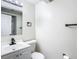 Modern bathroom with white vanity and fixtures at 10214 Turtle Hill Ct, Tampa, FL 33615