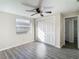 Bright bedroom with laminate flooring and double door closet at 10214 Turtle Hill Ct, Tampa, FL 33615