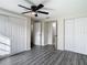 Bedroom with gray flooring, double closets and hallway access at 10214 Turtle Hill Ct, Tampa, FL 33615