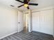 Bedroom with gray flooring, closet, and door to hallway at 10214 Turtle Hill Ct, Tampa, FL 33615