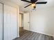 Bedroom featuring gray flooring, a closet, and access to another room at 10214 Turtle Hill Ct, Tampa, FL 33615