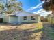 Light green house exterior with white trim at 10214 Turtle Hill Ct, Tampa, FL 33615