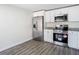 Modern kitchen with white cabinets, stainless steel appliances, and granite countertops at 10214 Turtle Hill Ct, Tampa, FL 33615