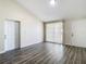 Spacious living room featuring light walls and wood-look floors at 10214 Turtle Hill Ct, Tampa, FL 33615